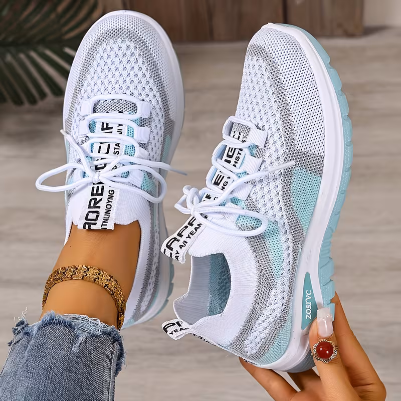 Women's Breathable Sneaker alternate colourway flat lay showing full pair and outsole grip pattern
