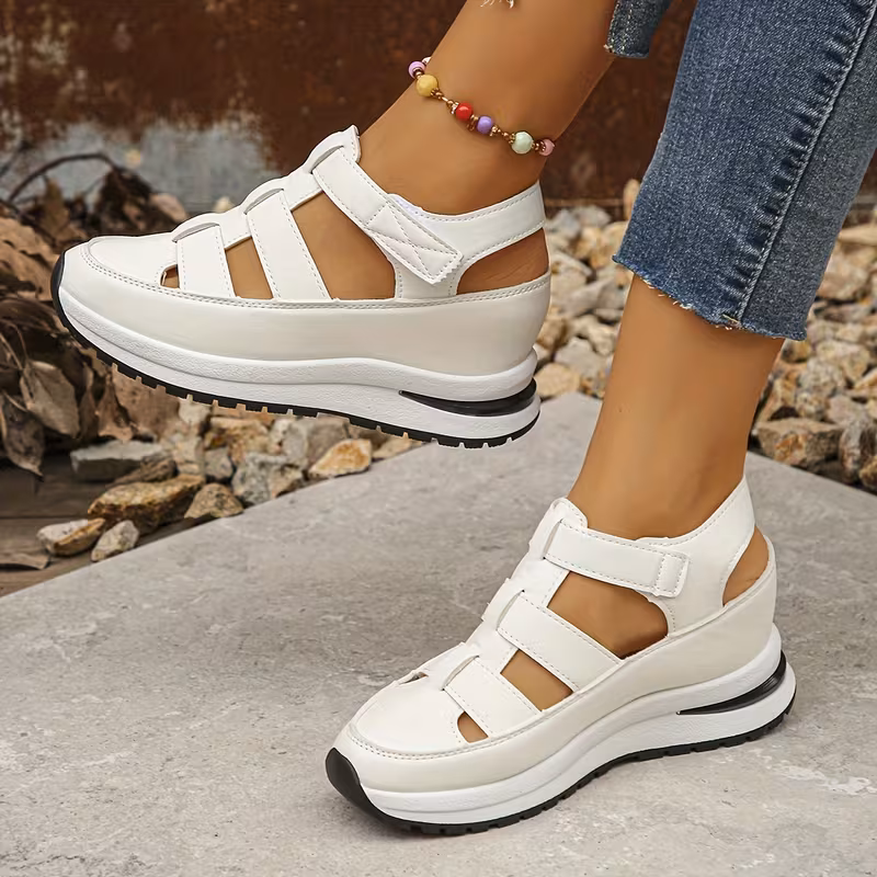 Hidden-heel wedge sandal — side profile showing concealed lift